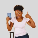 Happy woman holding passport