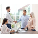 Migration Agent shaking hands with clients