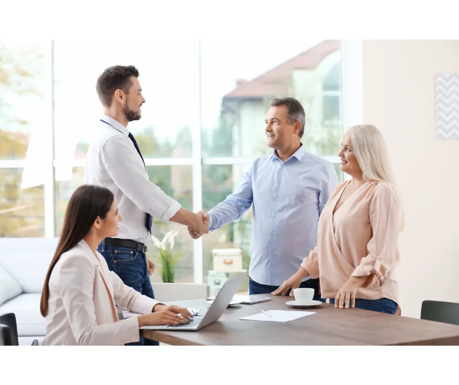 Migration Agent shaking hands with clients