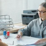 Woman checking papers