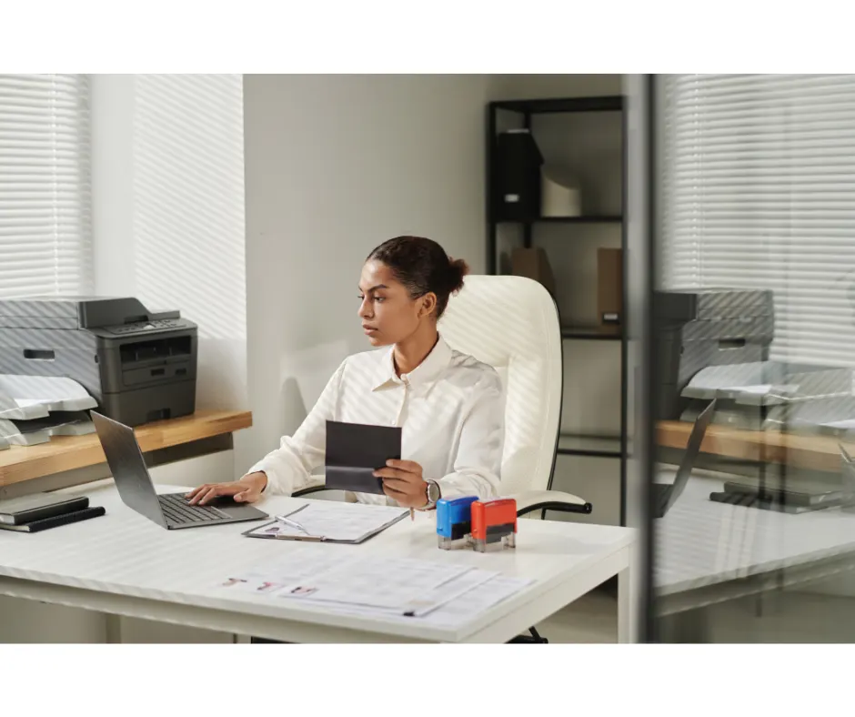 A female migration agent reviewing documents